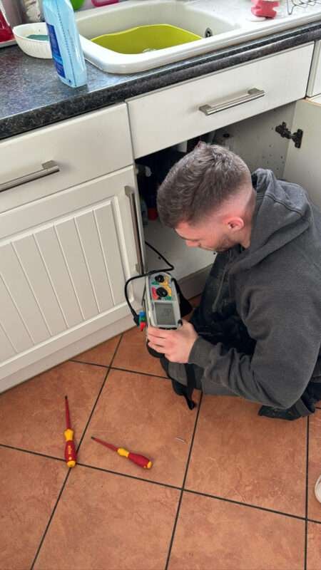 electrician completing an electrical inspection