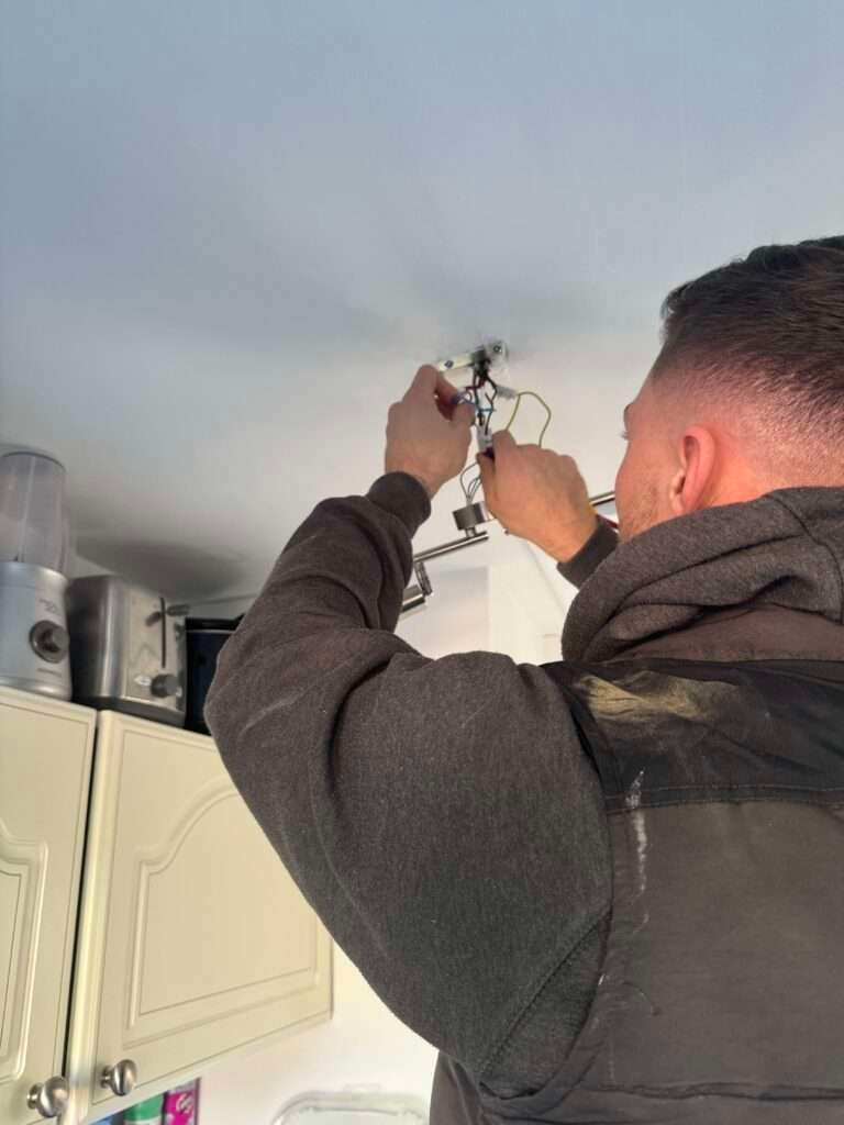 Indoor kitchen light being fitted in canterbury