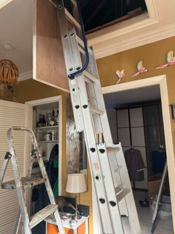 Electrician working inside a bungalow in margate wiring in.